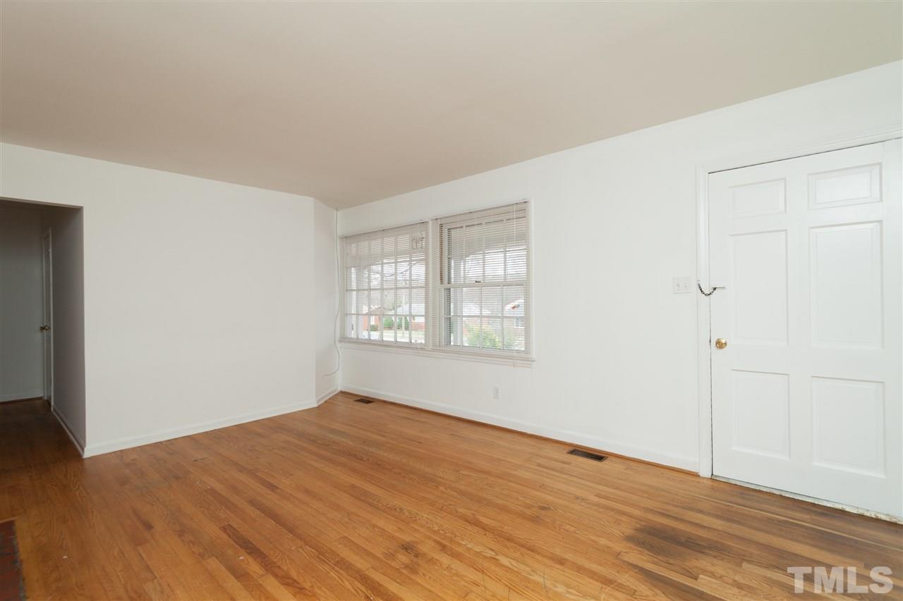 3105 Brentwood Road Raleigh, NC 27604 - Photo 8 of 25 a view of empty room with wooden floor and fan