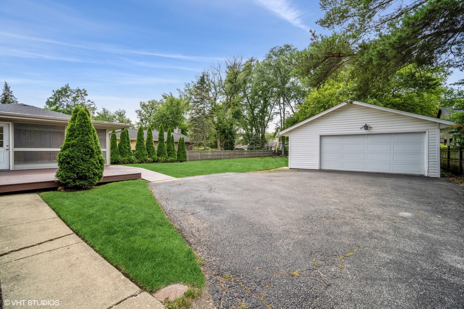 1644 Pfingsten Road Northbrook, IL 60062 - Photo 2 of 17 a front view of a house with a yard and garage