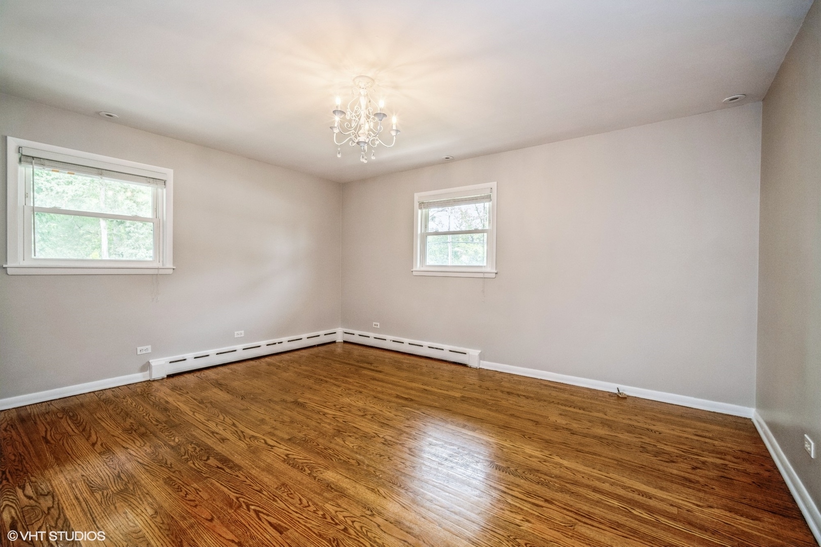 1644 Pfingsten Road Northbrook, IL 60062 - Photo 11 of 17 a view of an empty room with wooden floor and a window