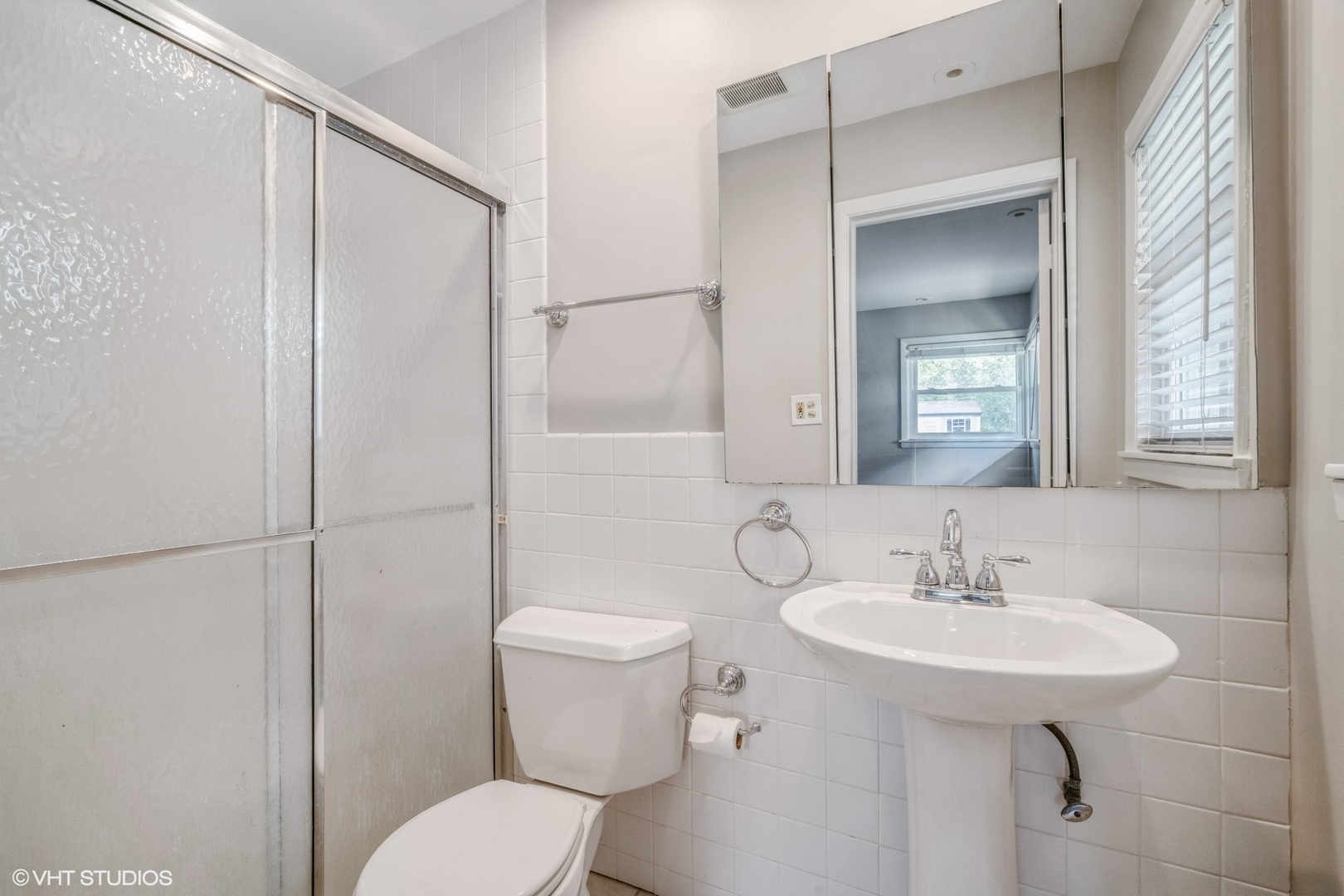 1644 Pfingsten Road Northbrook, IL 60062 - Photo 14 of 17 a bathroom with a sink toilet and shower