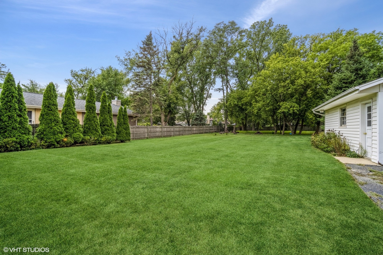 1644 Pfingsten Road Northbrook, IL 60062 - Photo 4 of 17 a view of a green field with trees in the background