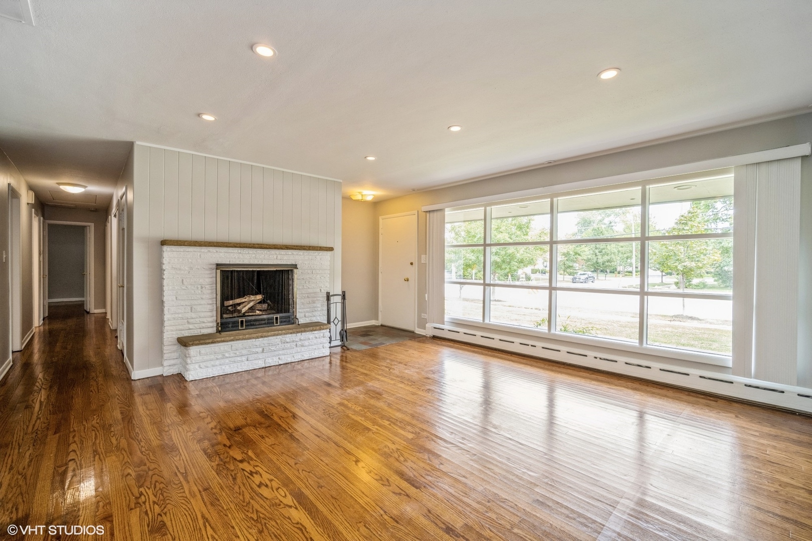 1644 Pfingsten Road Northbrook, IL 60062 - Photo 5 of 17 a view of an empty room with wooden floor and a window
