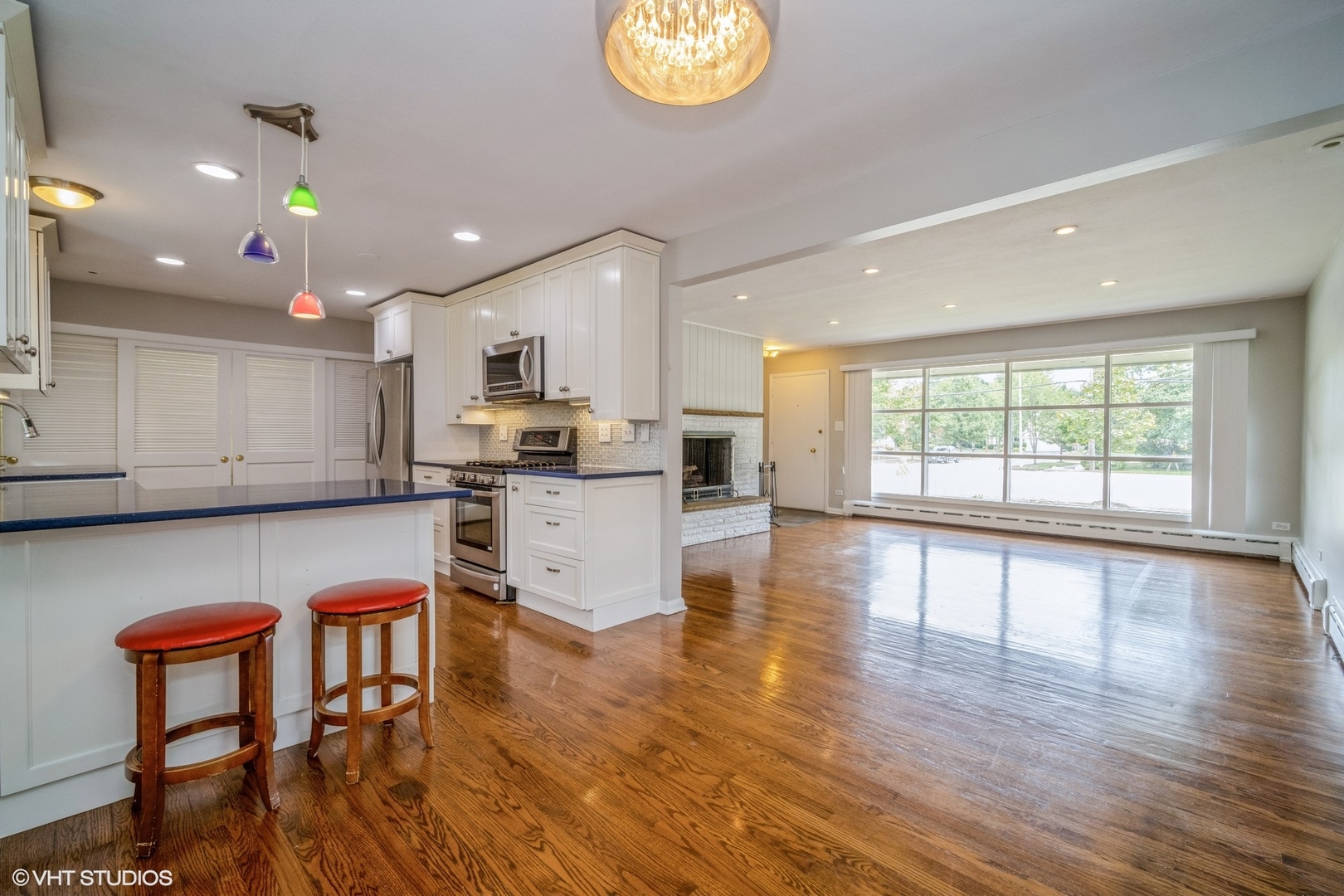 1644 Pfingsten Road Northbrook, IL 60062 - Photo 8 of 17 an open kitchen with wooden floor and stainless steel appliances
