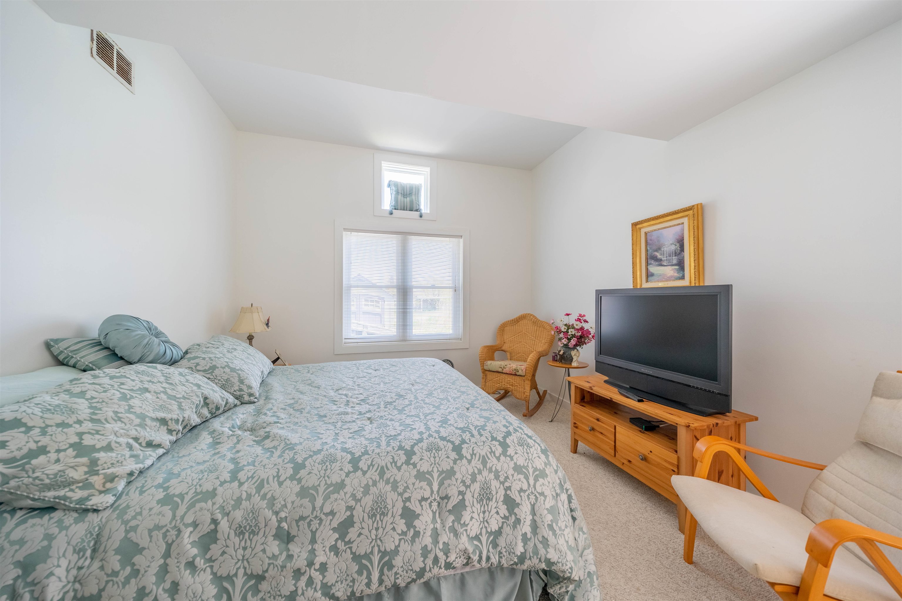 201 Lighthouse Cape May Point, NJ 08212 - Photo 11 of 24 a bedroom with a bed and a flat screen tv