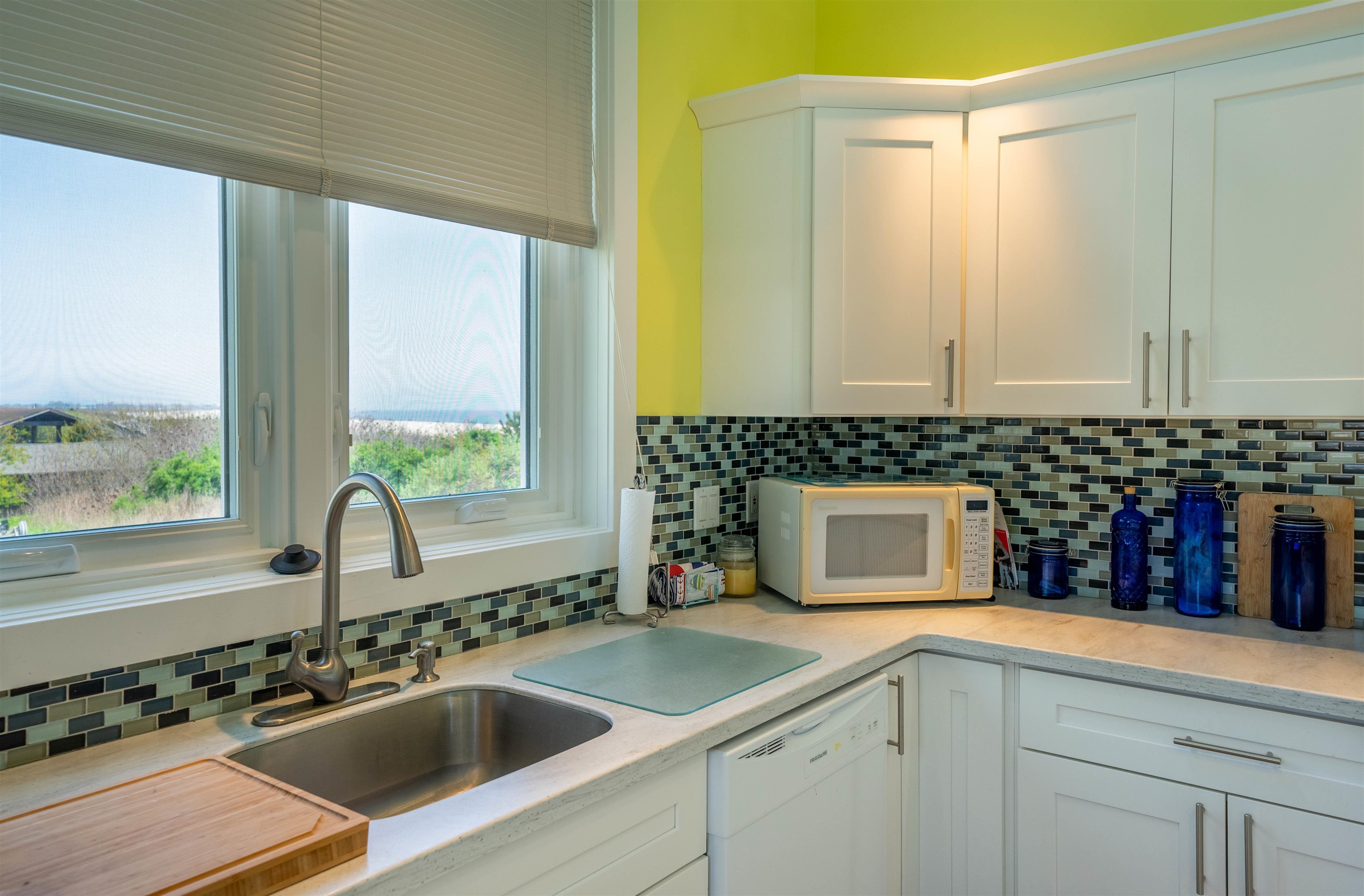 201 Lighthouse Cape May Point, NJ 08212 - Photo 14 of 24 a kitchen with a sink and a stove top oven
