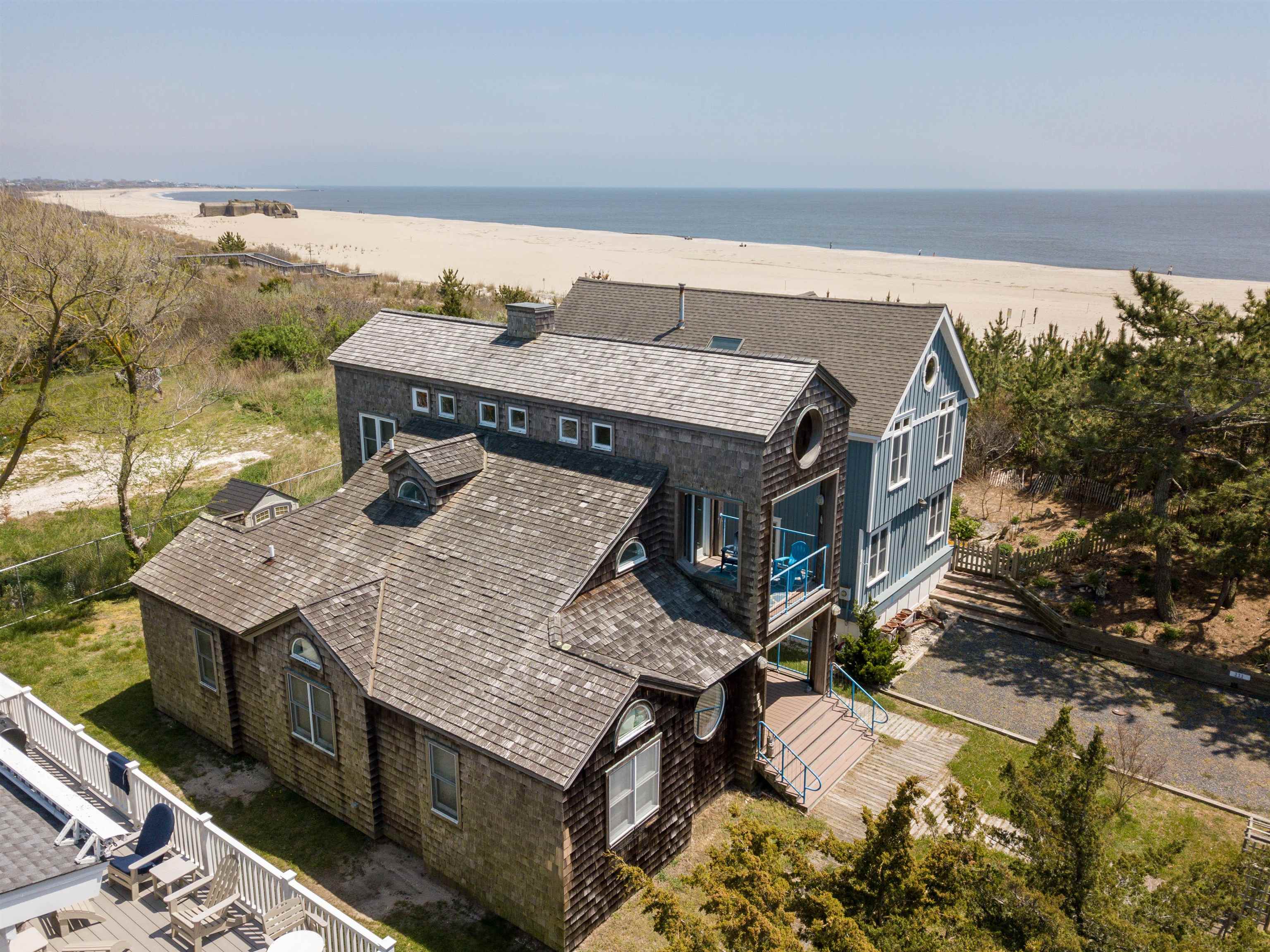 201 Lighthouse Cape May Point, NJ 08212 - Photo 22 of 24 a roof deck with a table and chairs