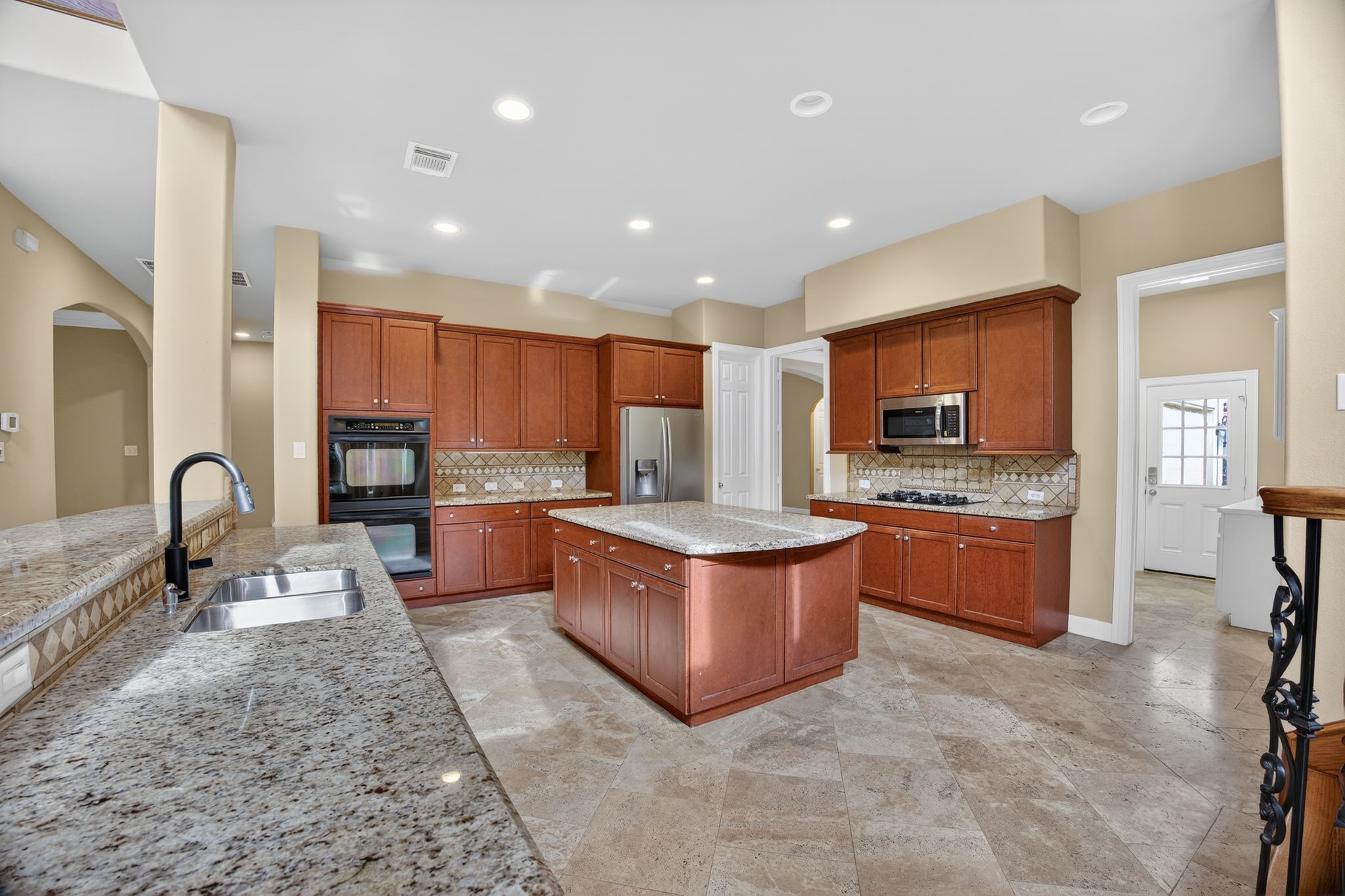 11511 Gallant Ridge Lane Houston, TX 77082 - Photo 18 of 49 a large kitchen with stainless steel appliances lots of counter top space
