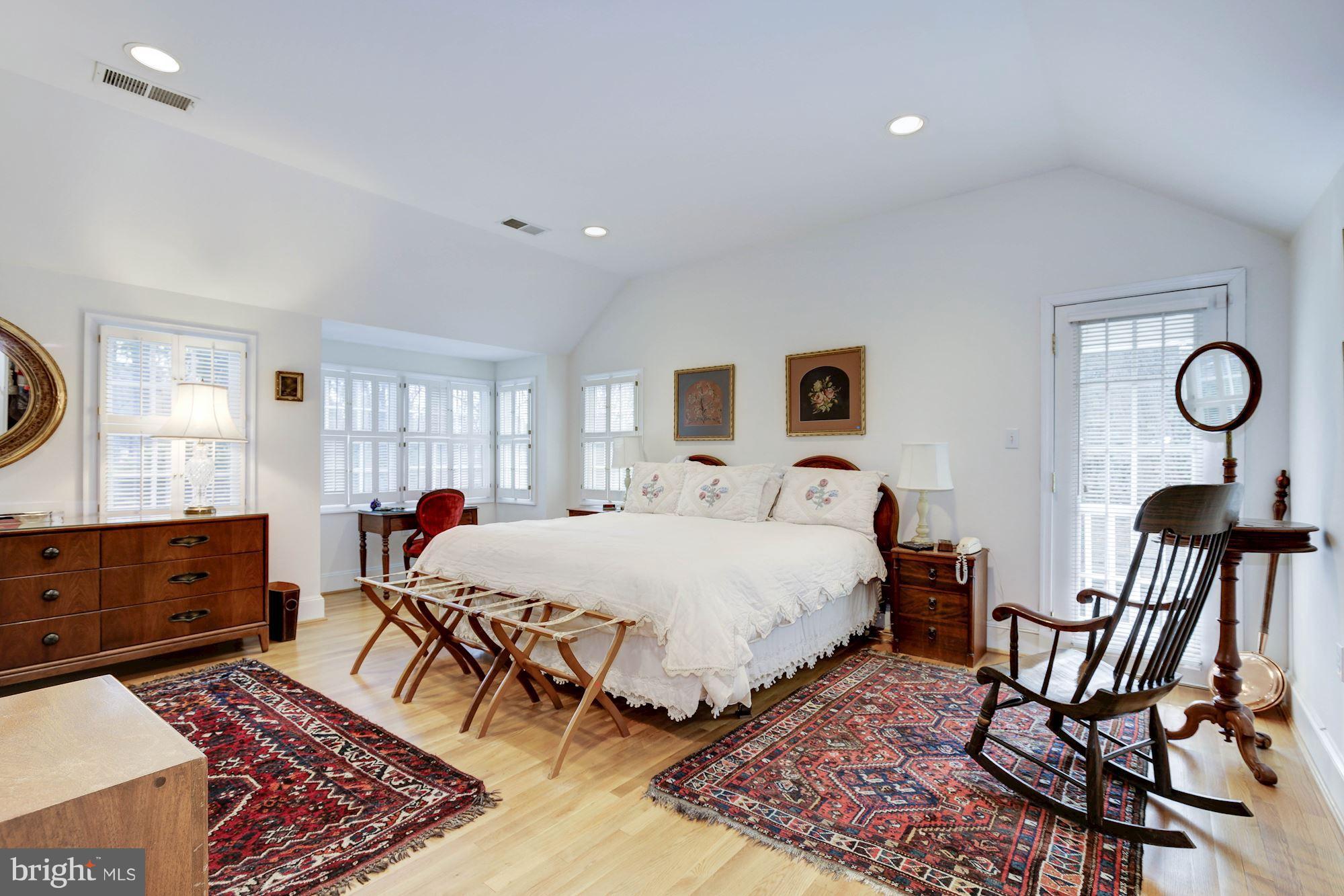 5220 Elliott Road Bethesda, MD 20816 - Photo 17 of 30 a bed room with a bed and chair
