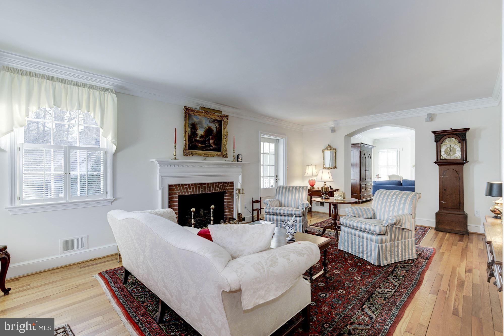 5220 Elliott Road Bethesda, MD 20816 - Photo 3 of 30 a living room with fireplace furniture and a fireplace