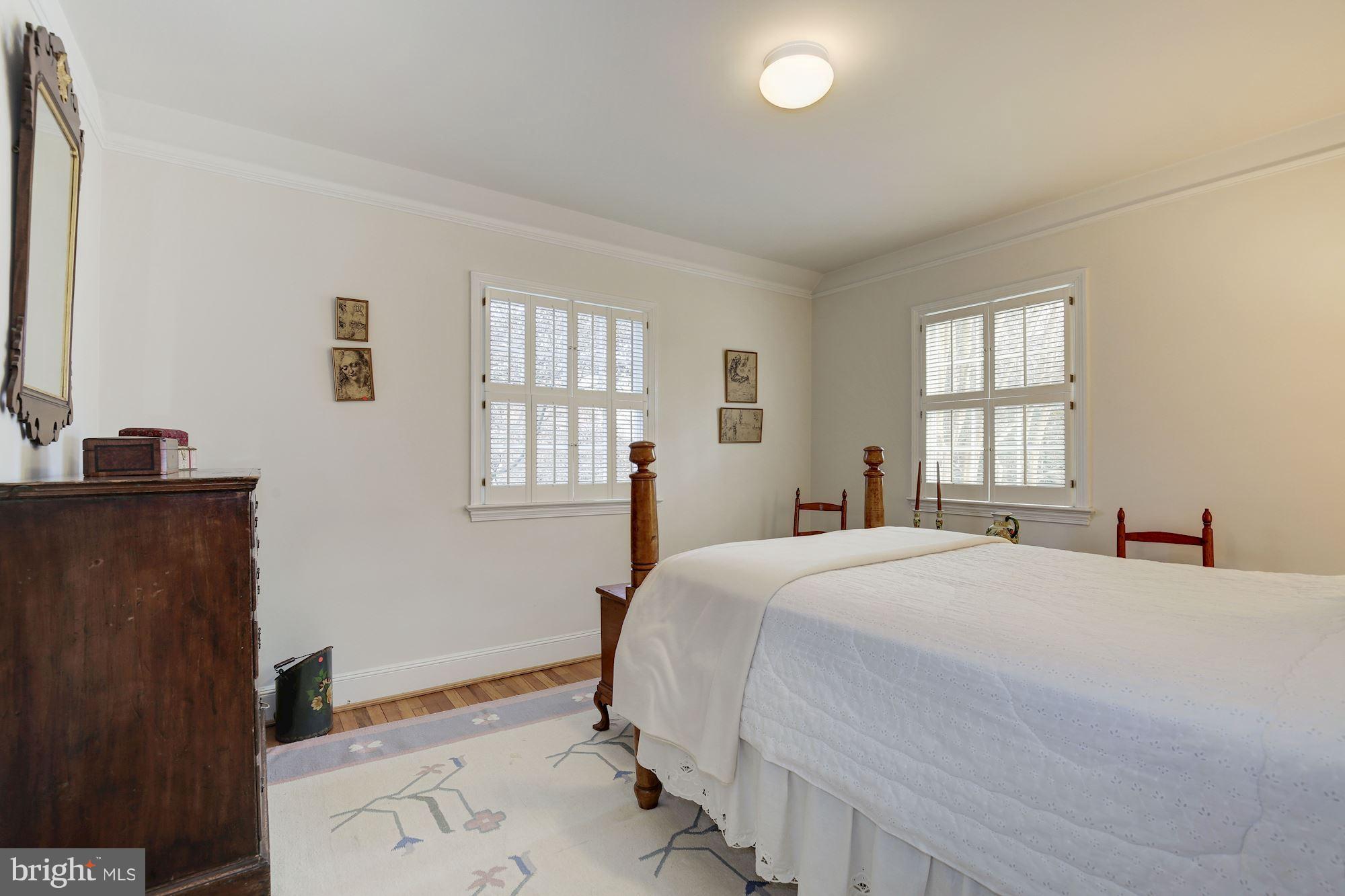 5220 Elliott Road Bethesda, MD 20816 - Photo 21 of 30 a bedroom with a bed and a window