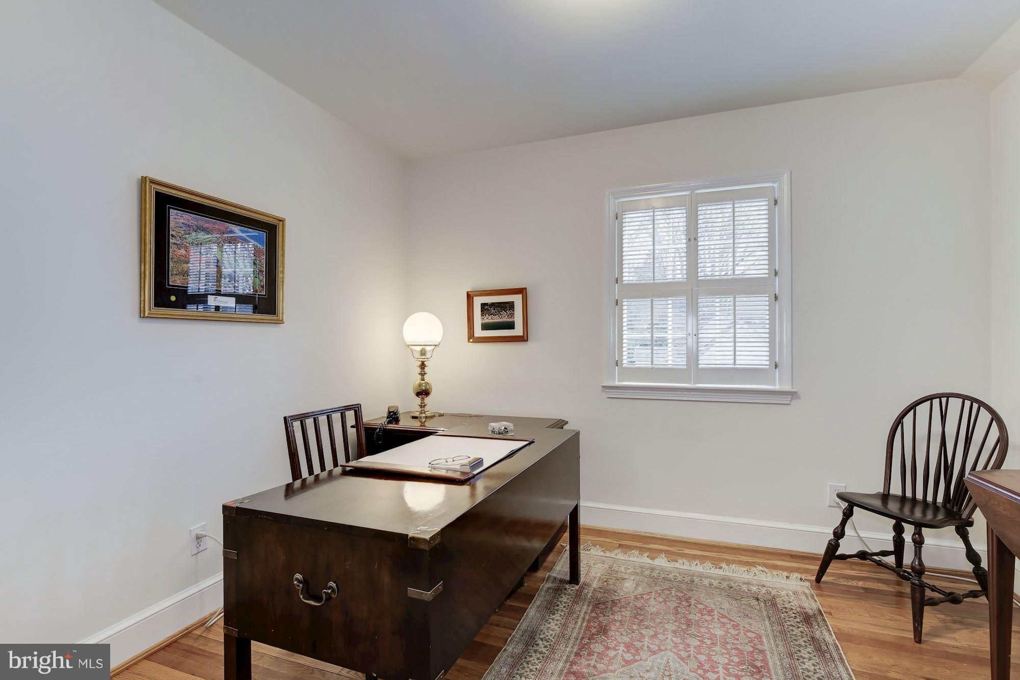 5220 Elliott Road Bethesda, MD 20816 - Photo 23 of 30 a room with furniture and a window