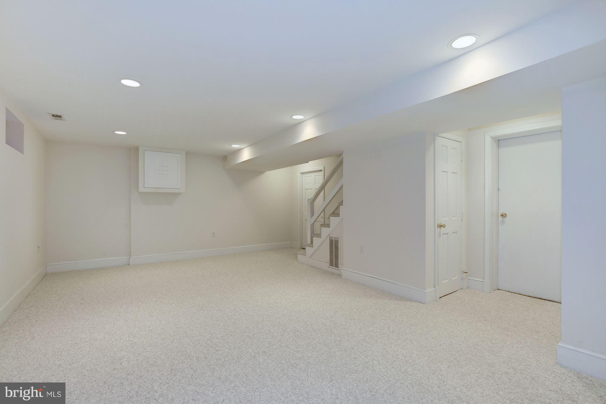 5220 Elliott Road Bethesda, MD 20816 - Photo 26 of 30 an empty room with a cabinet and a window
