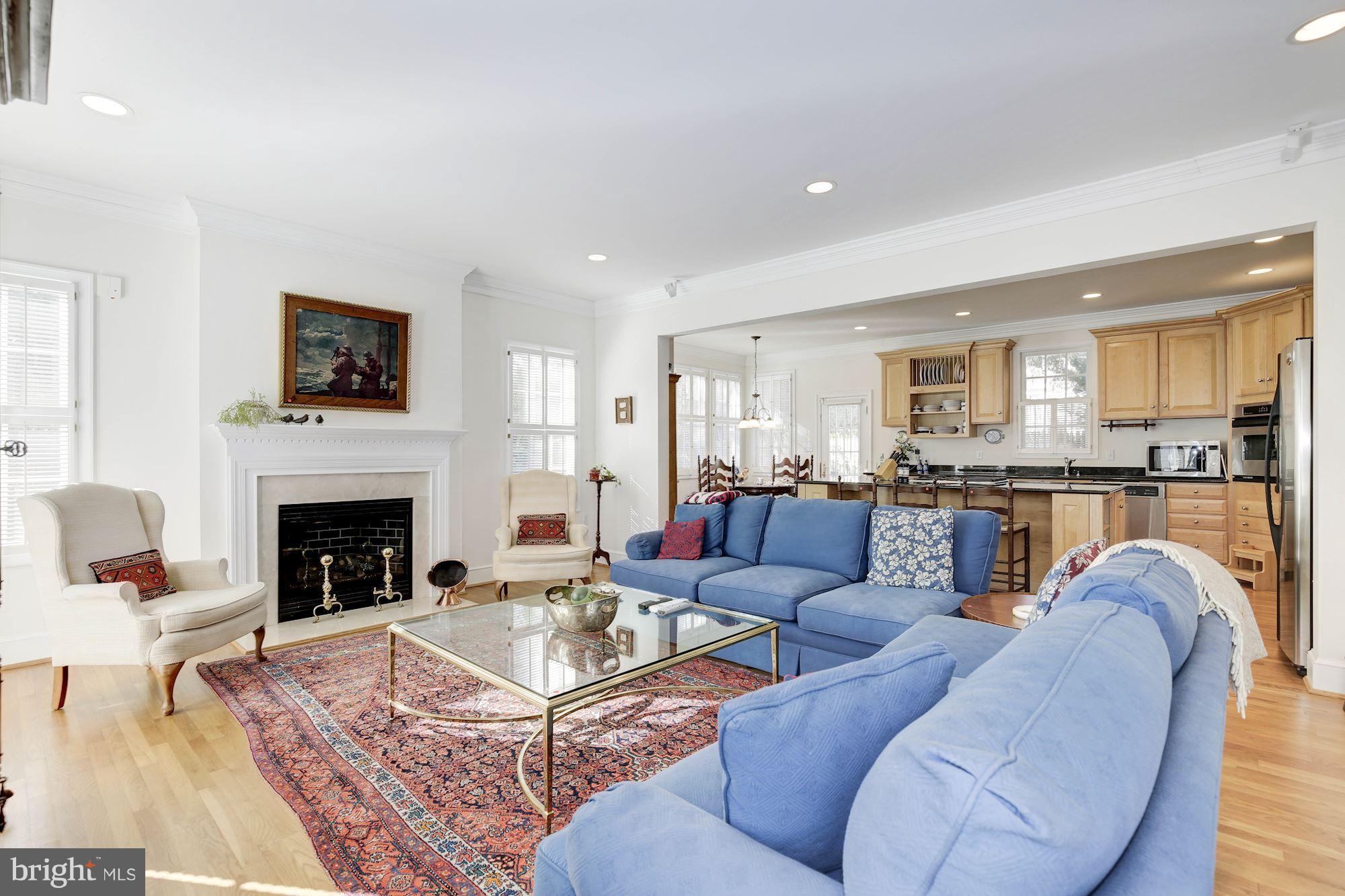 5220 Elliott Road Bethesda, MD 20816 - Photo 5 of 30 a living room with furniture fireplace and kitchen view