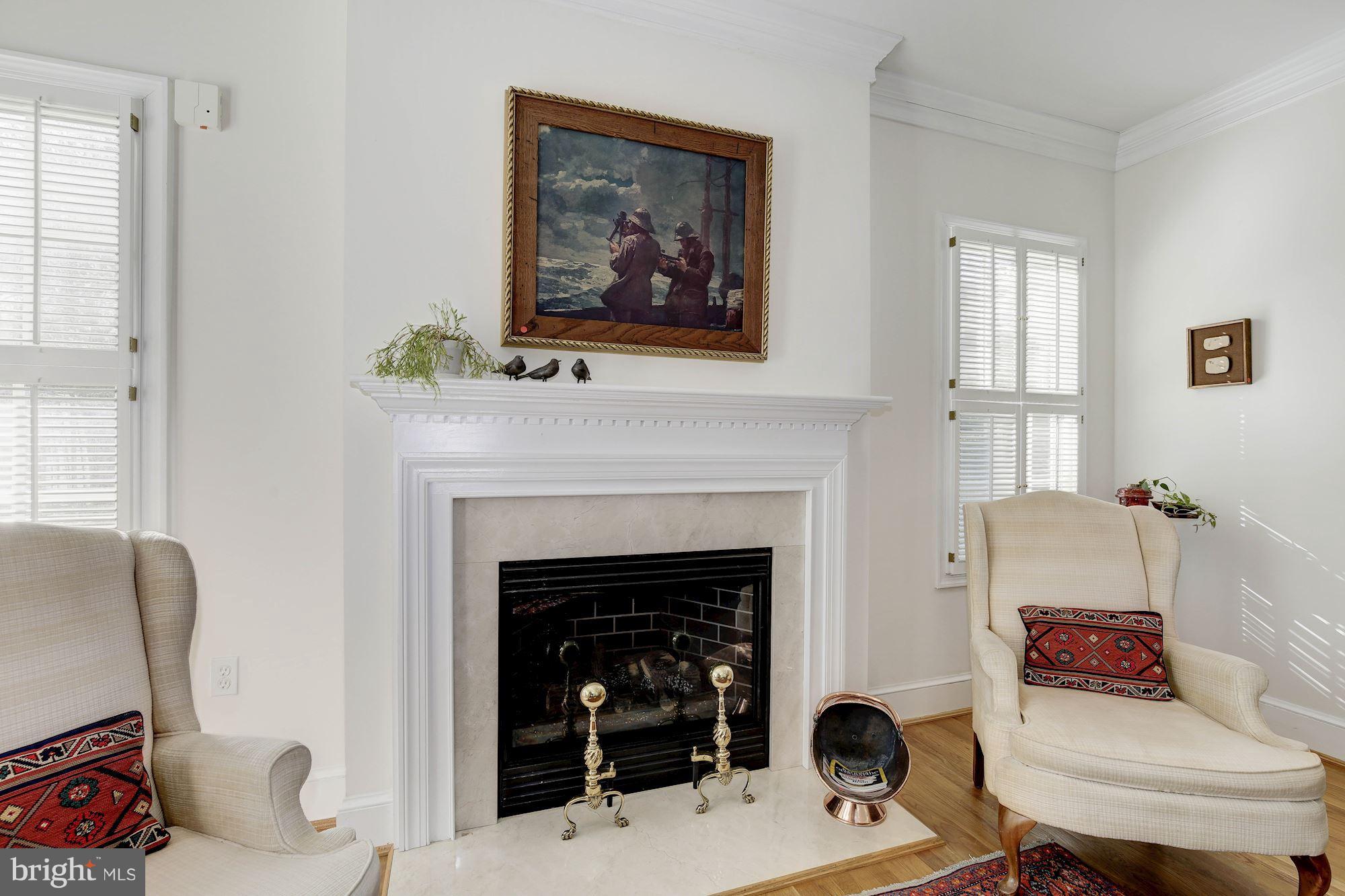 5220 Elliott Road Bethesda, MD 20816 - Photo 7 of 30 a living room with furniture and a fireplace