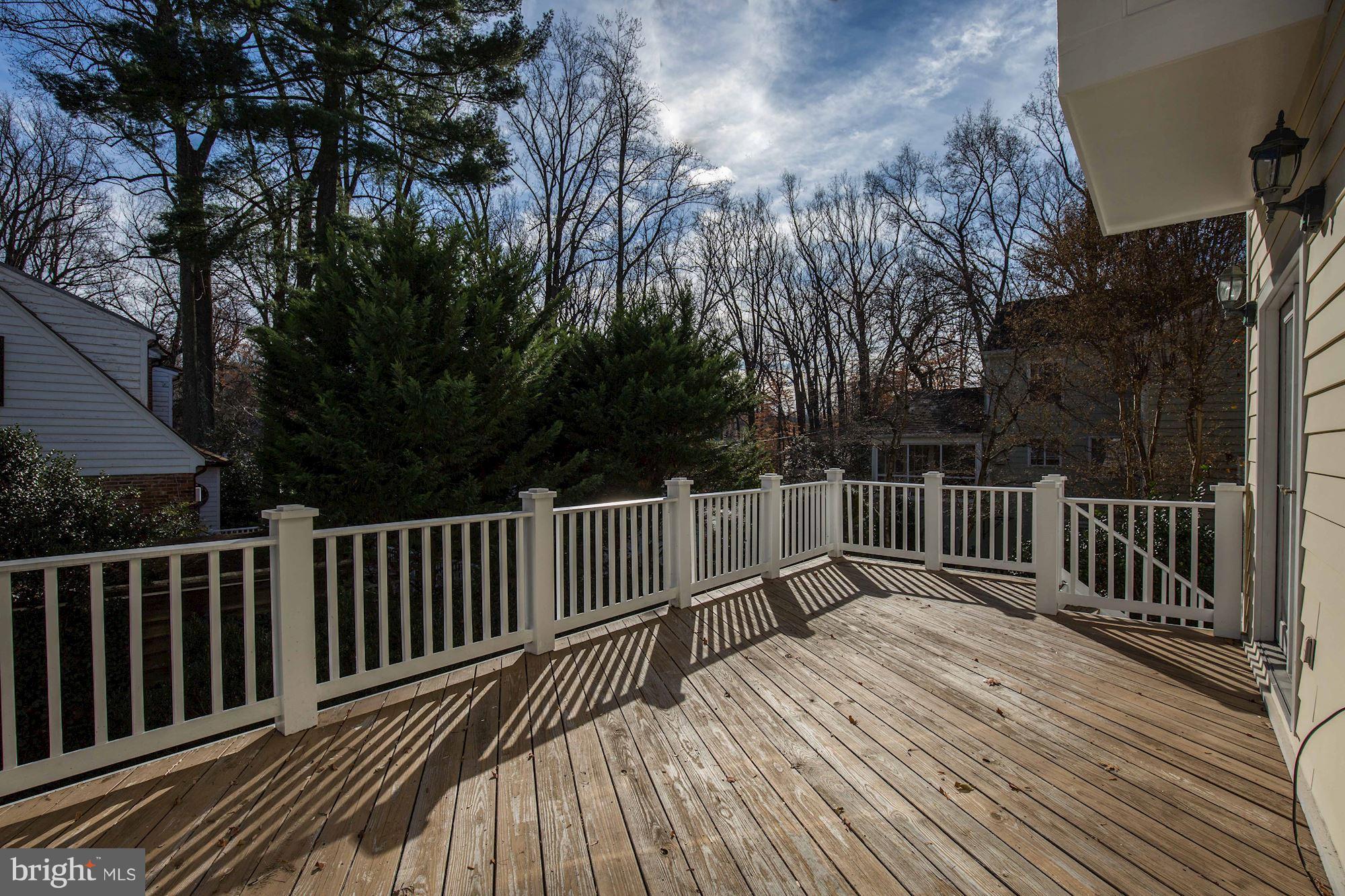 5220 Elliott Road Bethesda, MD 20816 - Photo 9 of 30 a view of balcony with wooden floor and fence