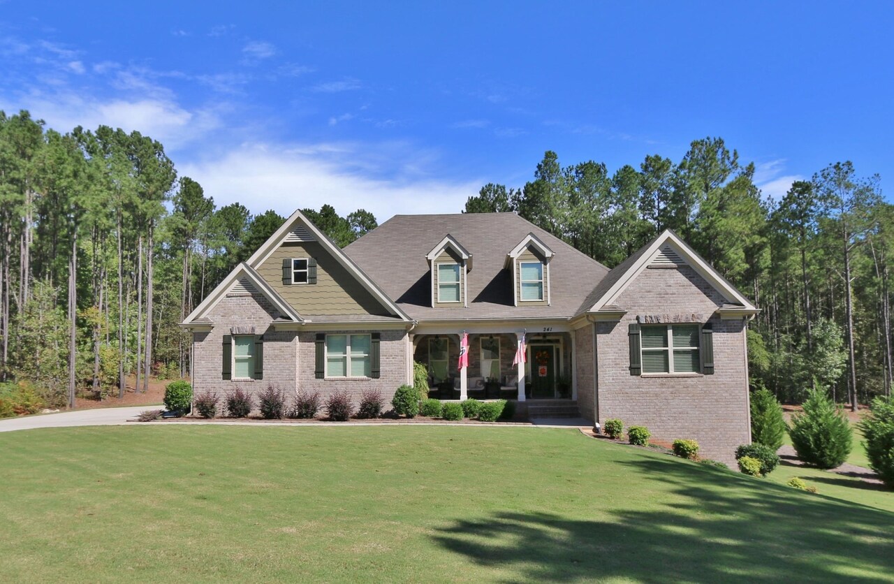 241 Hidden Springs Drive Rutledge, GA 30663 - Photo 1 of 1 a front view of a house with a garden
