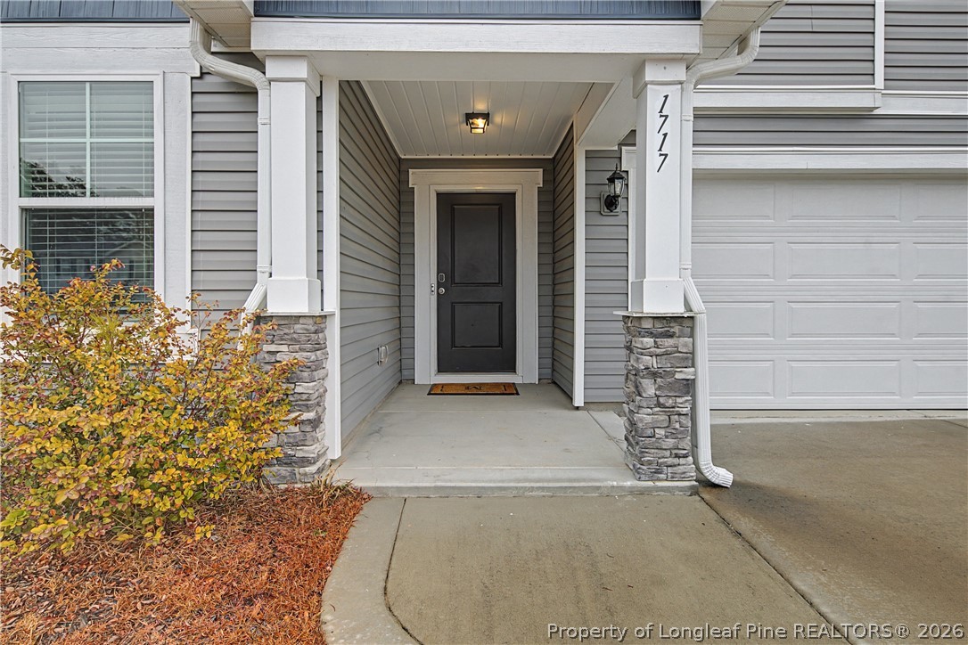 1717 Ennismore Road Hope Mills, NC 28348 - Photo 2 of 33 a view of front door with outdoor space