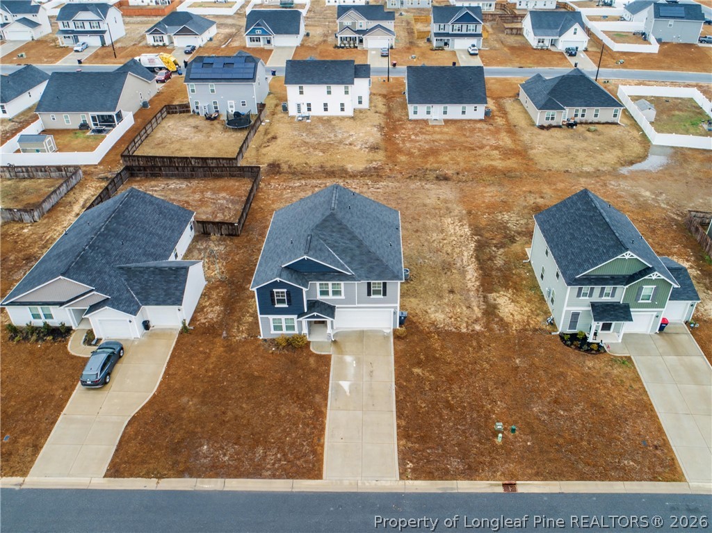 1717 Ennismore Road Hope Mills, NC 28348 - Photo 29 of 33 an aerial view of a house with swimming pool