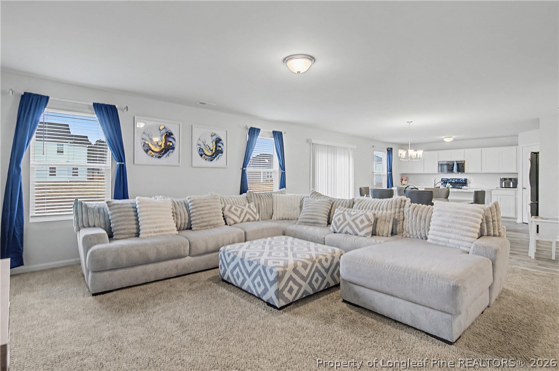 1717 Ennismore Road Hope Mills, NC 28348 - Photo 3 of 33 a living room with furniture and a large mirror