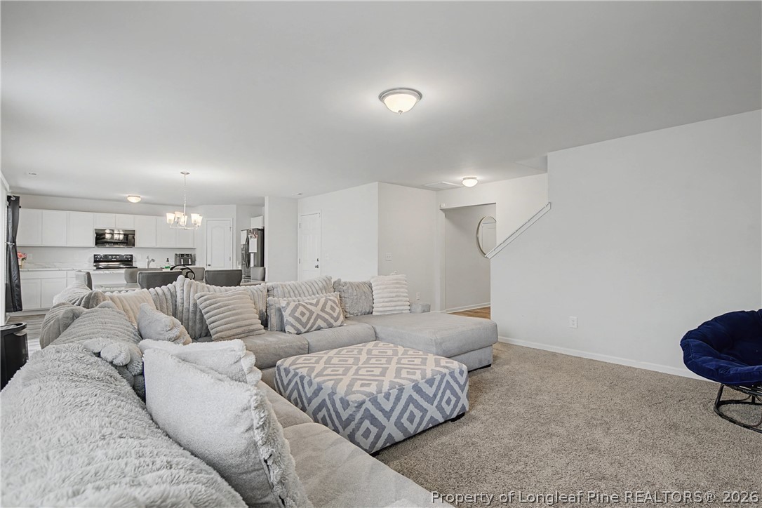 1717 Ennismore Road Hope Mills, NC 28348 - Photo 4 of 33 a living room with furniture and a couch