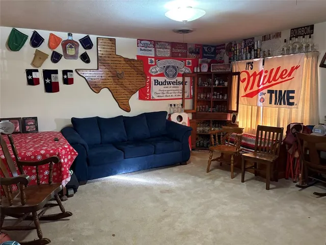 a view of a bedroom with furniture and a couch