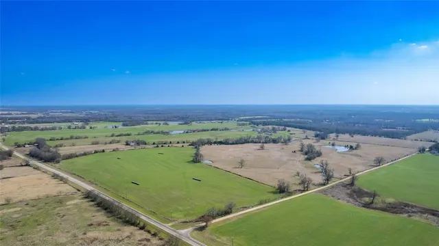 an aerial view of a golf course with beach