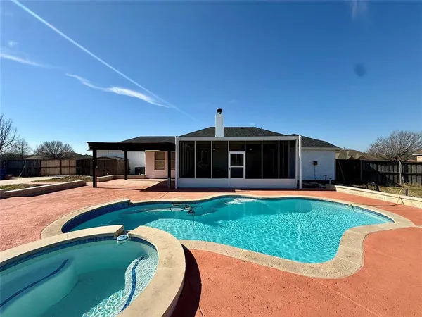 a view of a house with swimming pool and porch