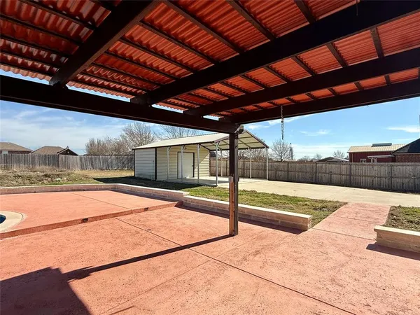 a view of a backyard of the house
