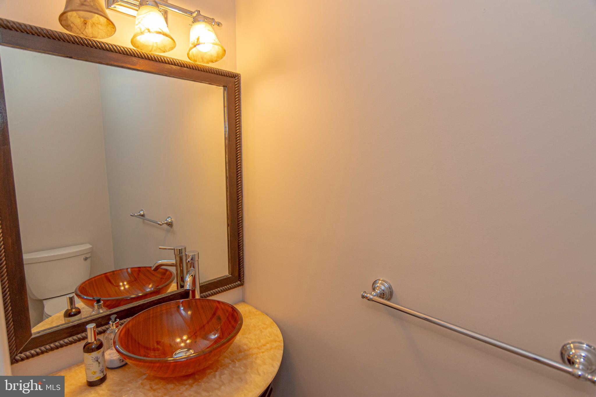 6 Howe Court Pennington, NJ 08534 - Photo 11 of 35 a bathroom with a sink and a mirror