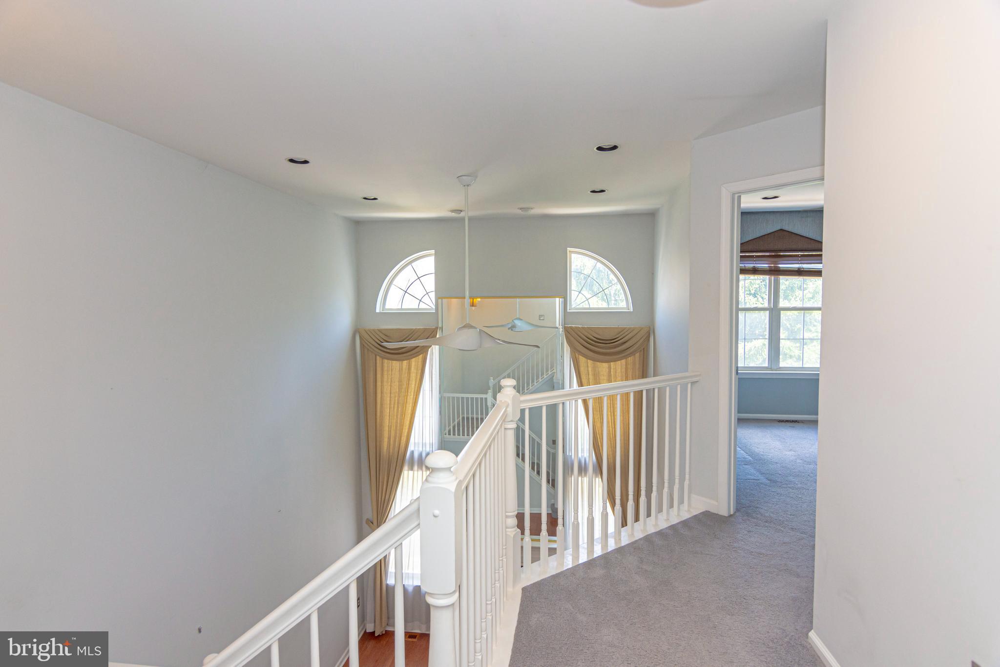 6 Howe Court Pennington, NJ 08534 - Photo 14 of 35 a view of staircase with railing and stairs