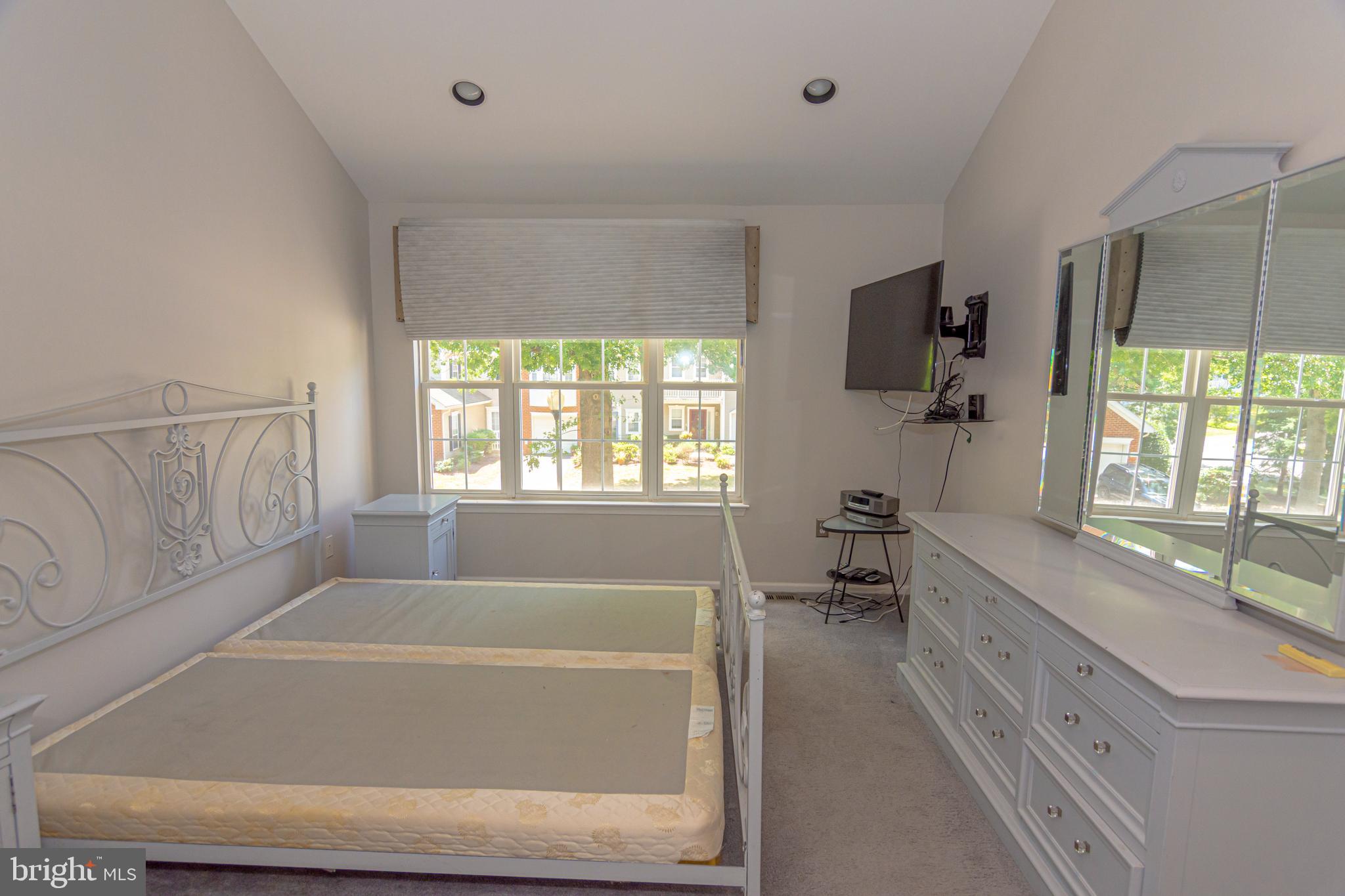 6 Howe Court Pennington, NJ 08534 - Photo 15 of 35 a bathroom with a bathtub a sink a window and a mirror