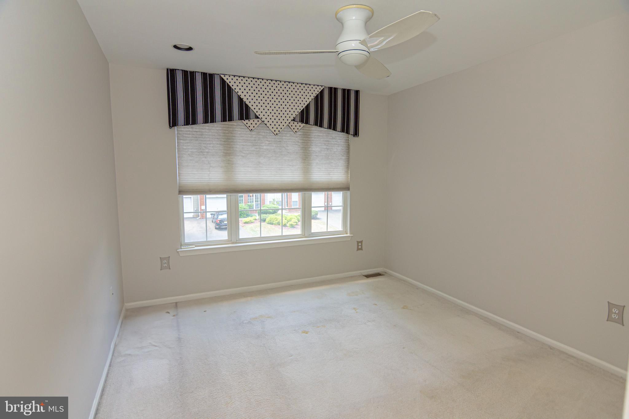 6 Howe Court Pennington, NJ 08534 - Photo 20 of 35 an empty room with windows and ceiling fan
