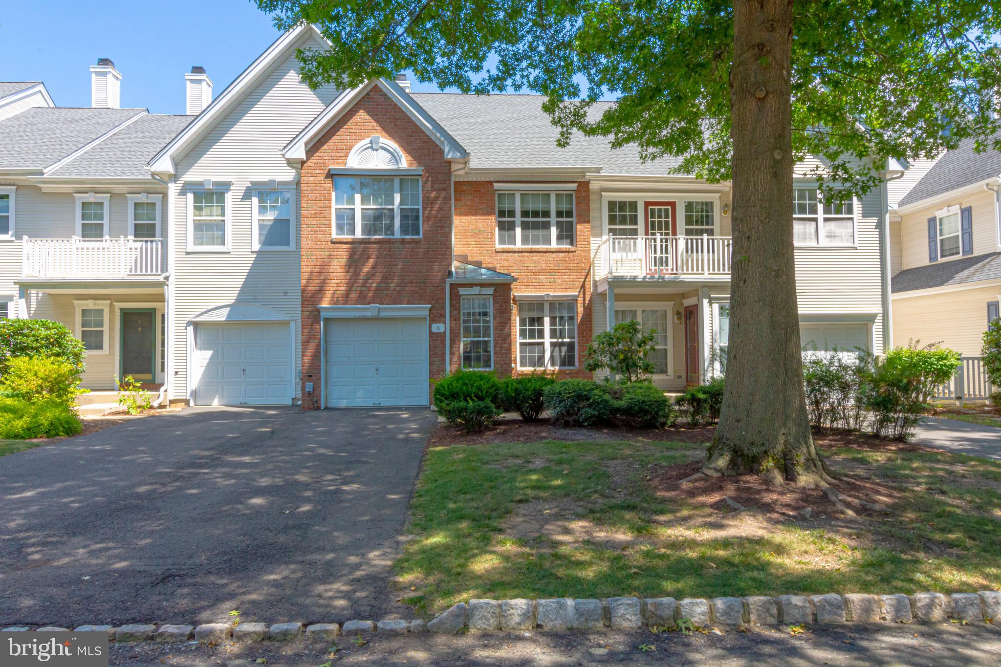 6 Howe Court Pennington, NJ 08534 - Photo 2 of 35 a front view of a house with garden