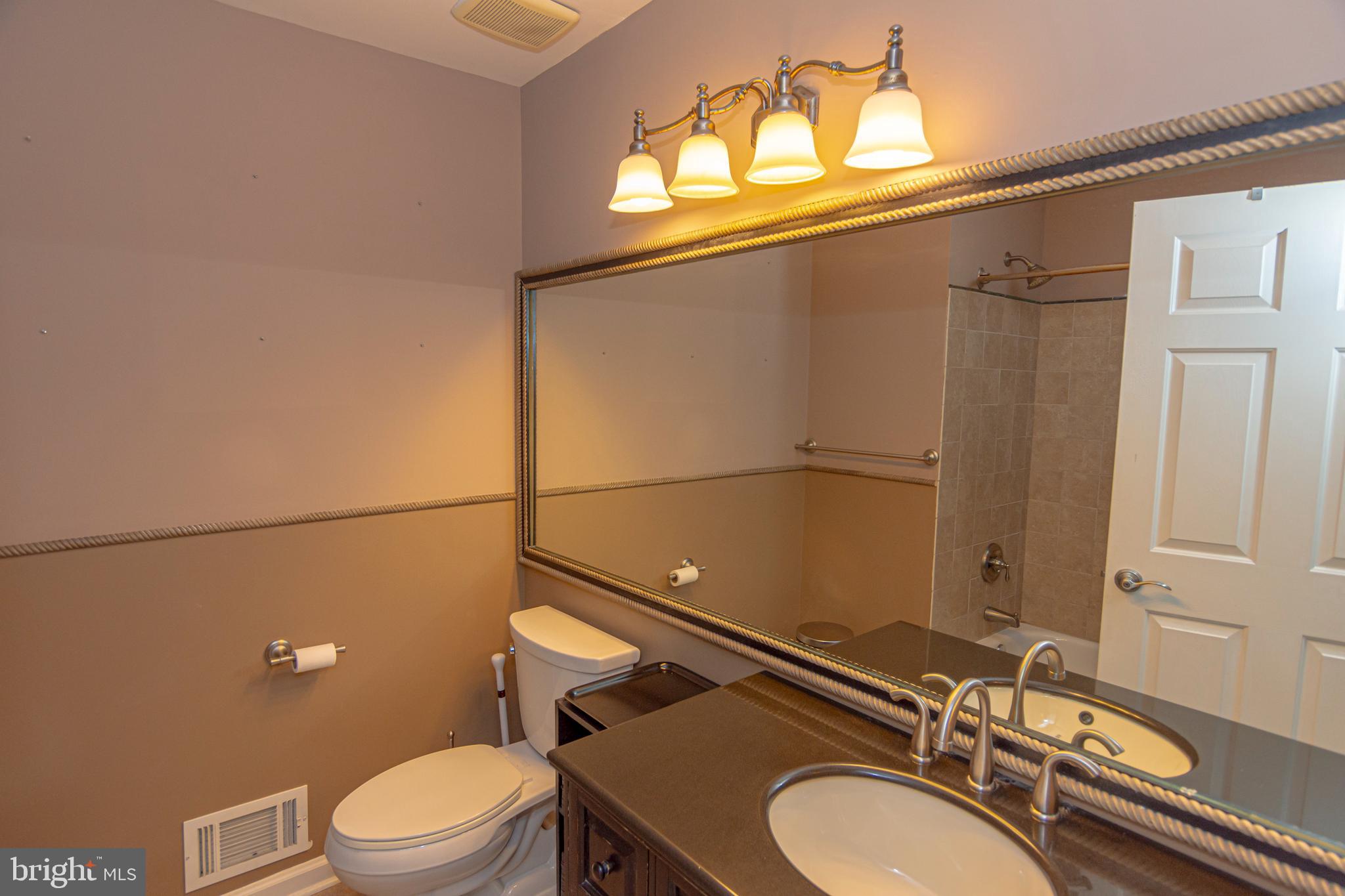 6 Howe Court Pennington, NJ 08534 - Photo 24 of 35 a bathroom with a sink mirror vanity and toilet