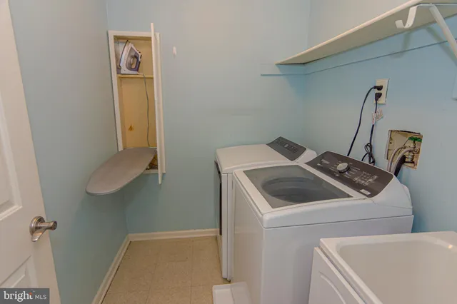 an empty room that has a grey walls