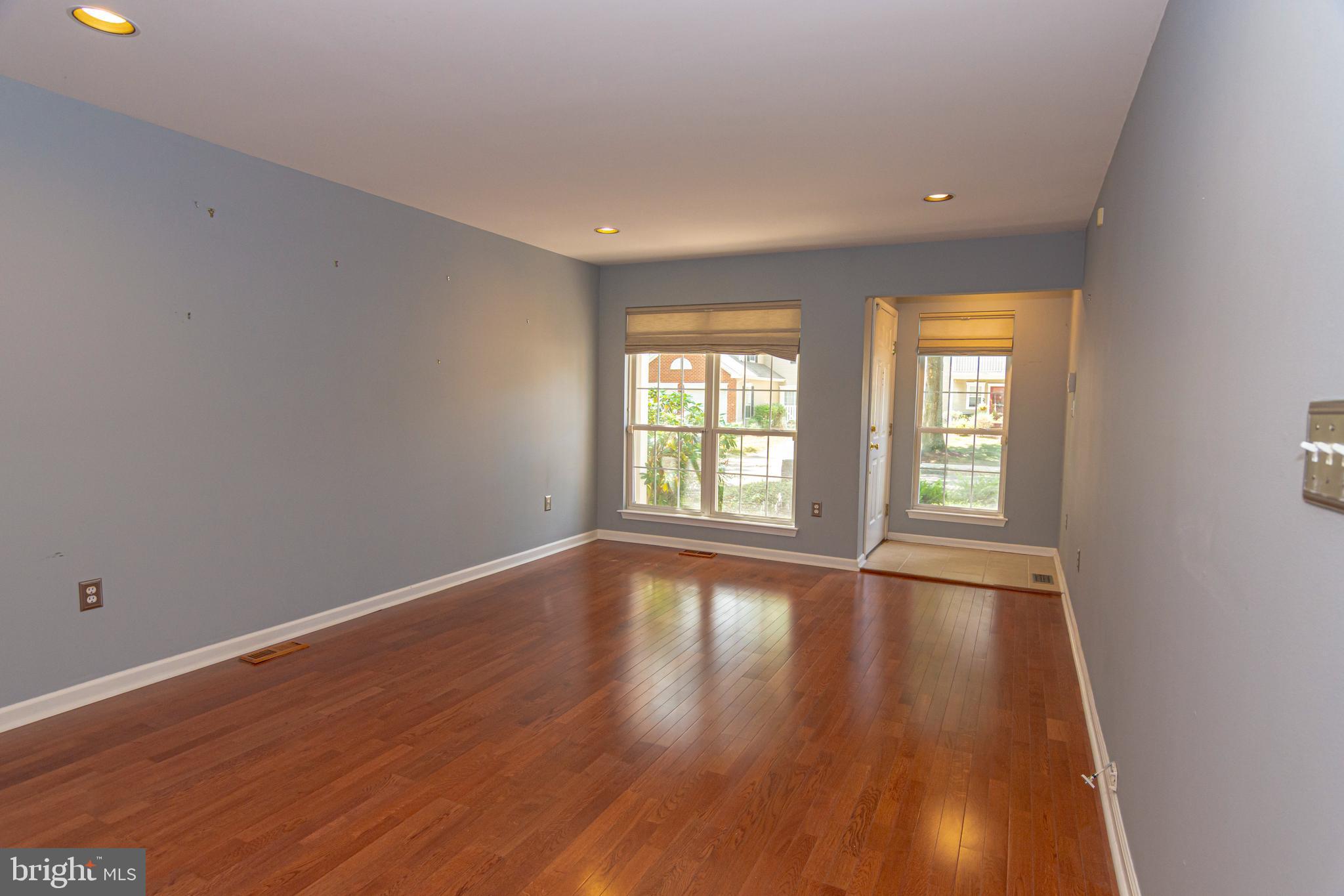 6 Howe Court Pennington, NJ 08534 - Photo 7 of 35 a view of an empty room with wooden floor and a window