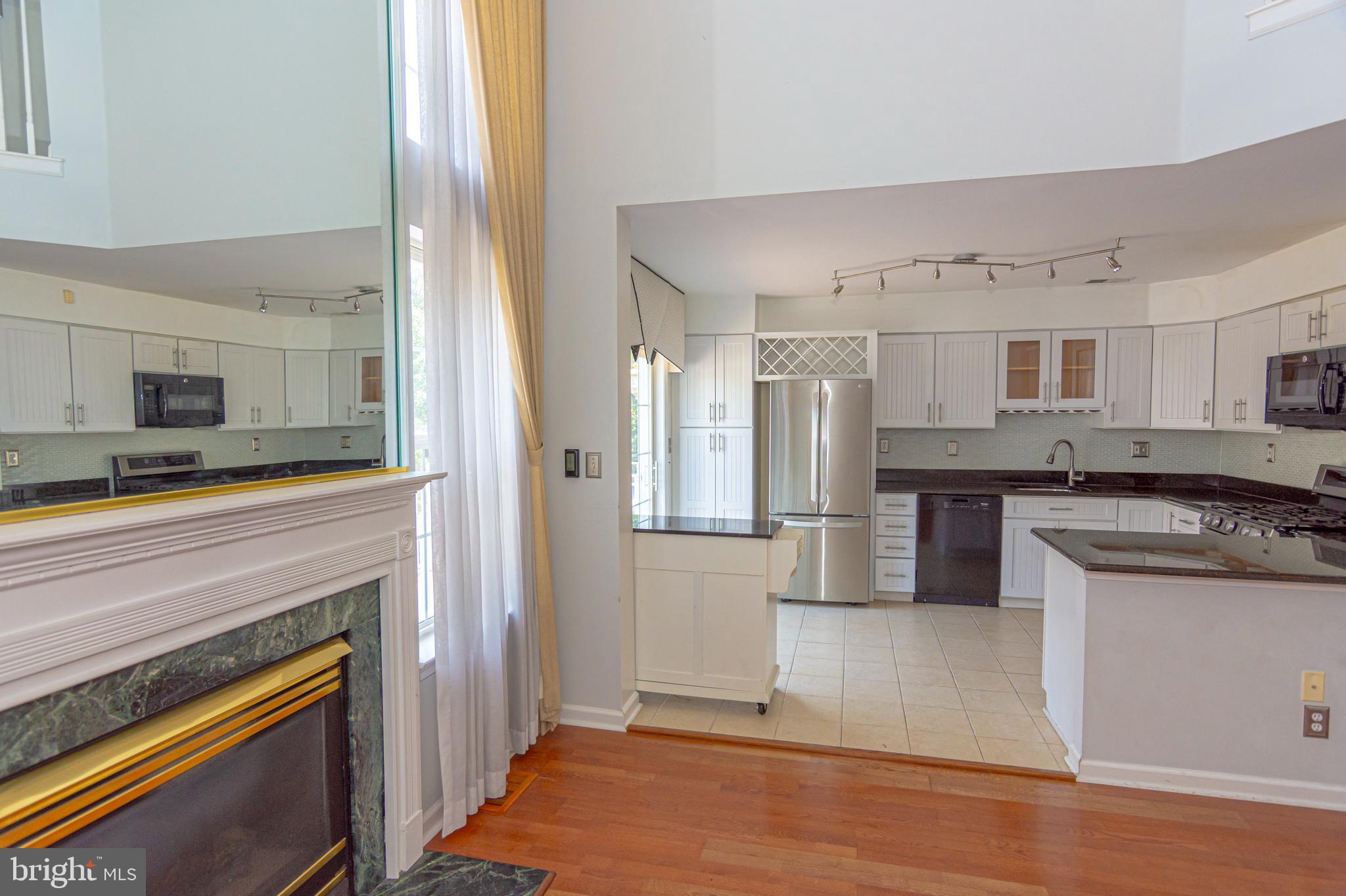6 Howe Court Pennington, NJ 08534 - Photo 10 of 35 a kitchen with stainless steel appliances granite countertop a refrigerator and a stove top oven