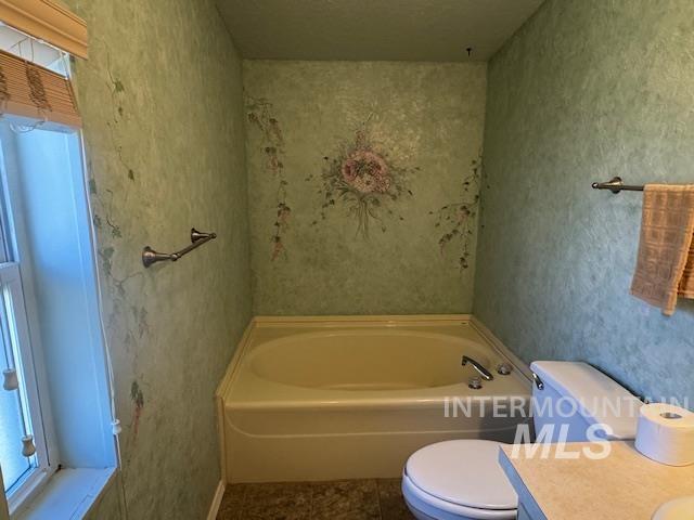 910 Moonglo, Unit 49 Buhl, ID 83316 - Photo 11 of 16 Full bathroom with a bath, vanity, and tile patterned floors