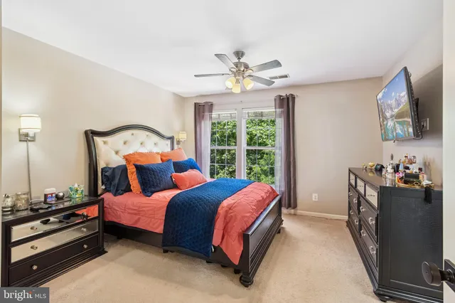 a bed room with a bed and a window