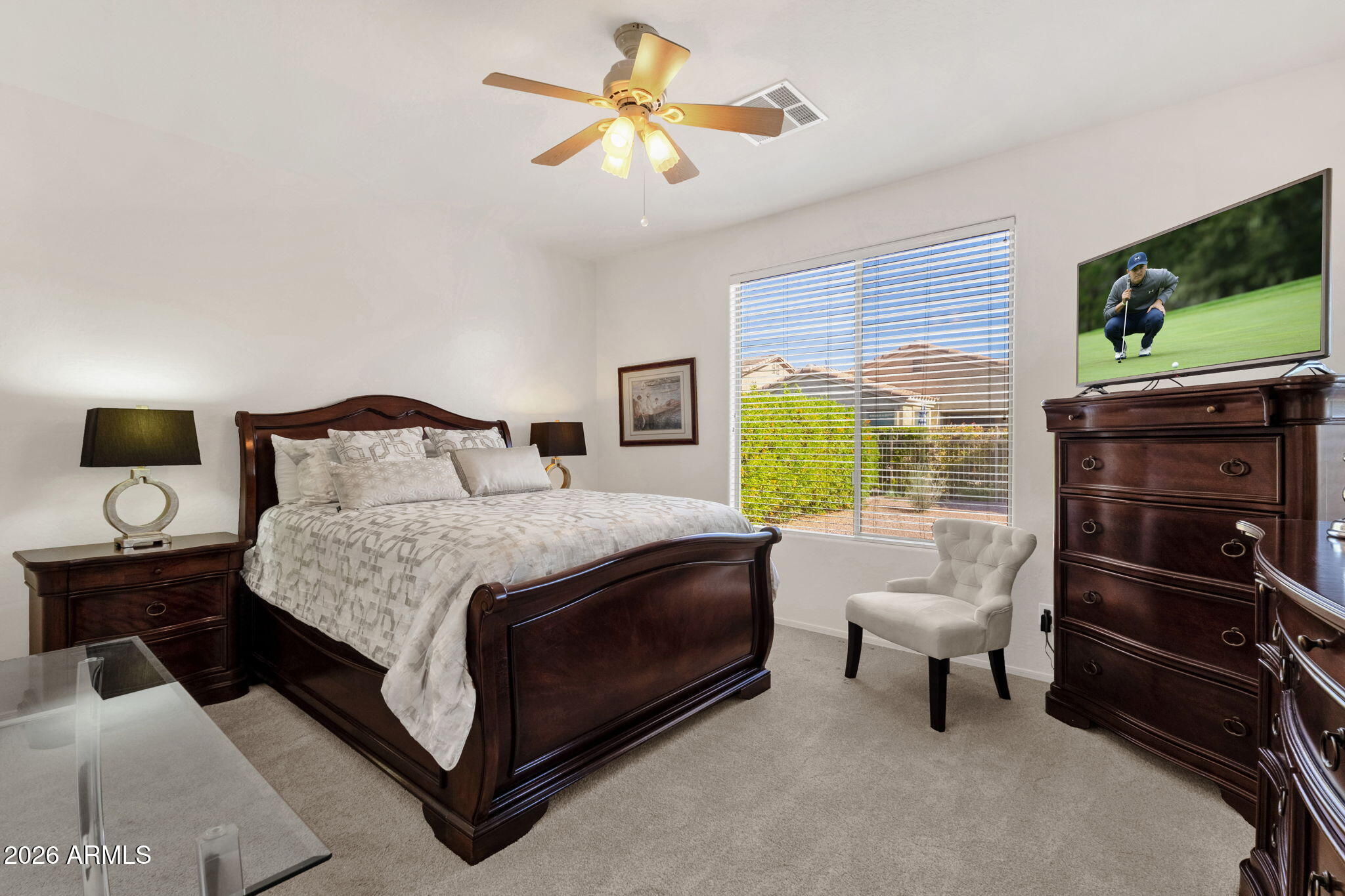 4094 East Azalea Drive Gilbert, AZ 85298 - Photo 13 of 21 a bedroom with a bed and a flat screen tv