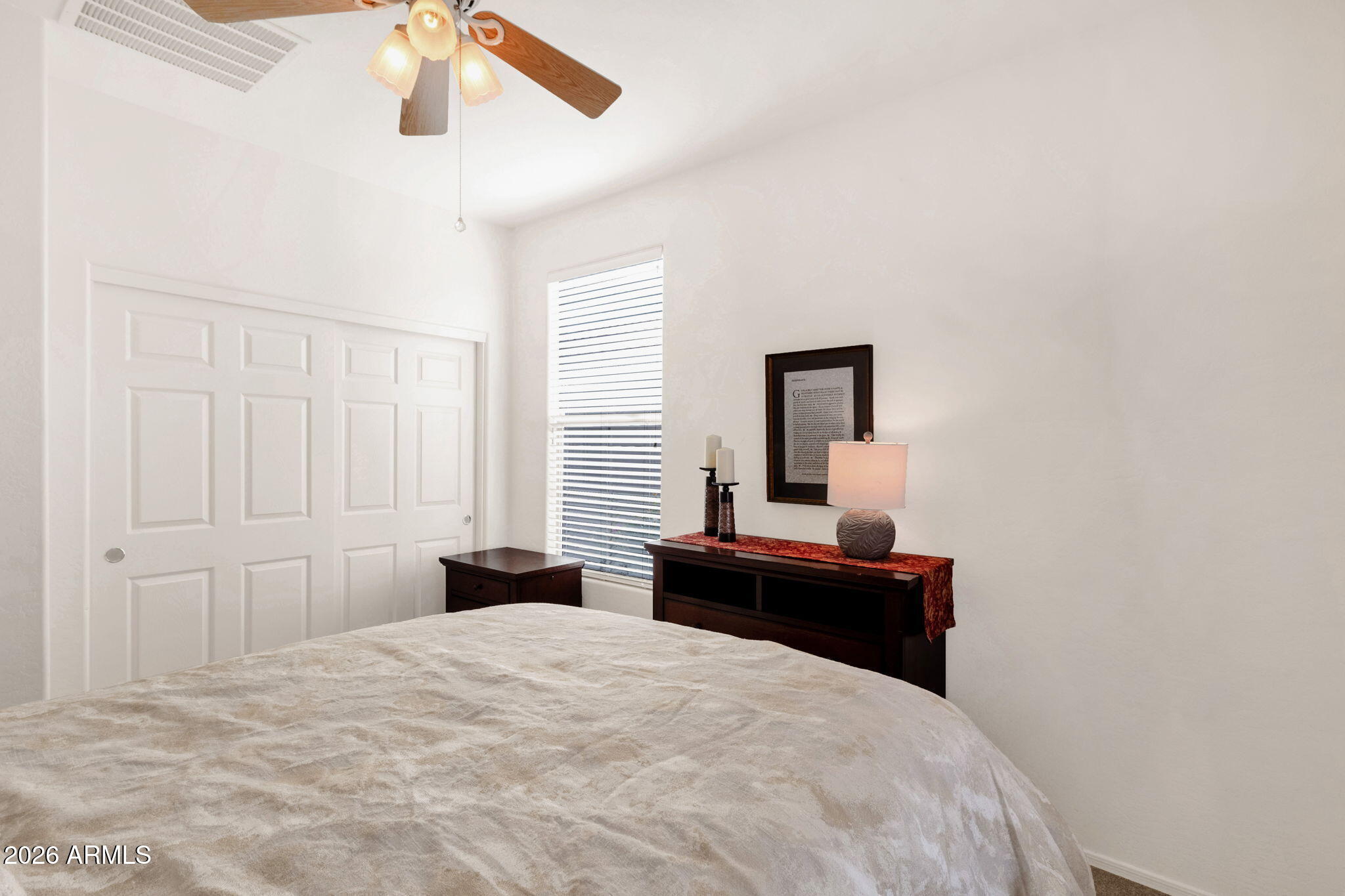 4094 East Azalea Drive Gilbert, AZ 85298 - Photo 15 of 21 a bedroom with a bed and a chandelier