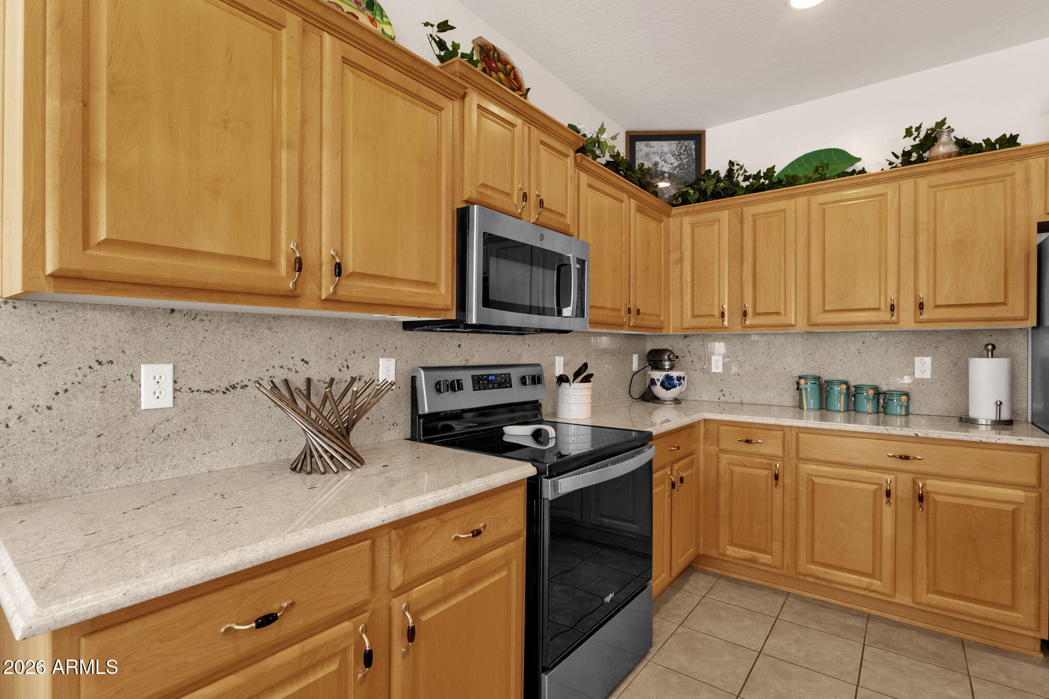 4094 East Azalea Drive Gilbert, AZ 85298 - Photo 8 of 21 a kitchen with cabinets appliances a sink and a counter top space