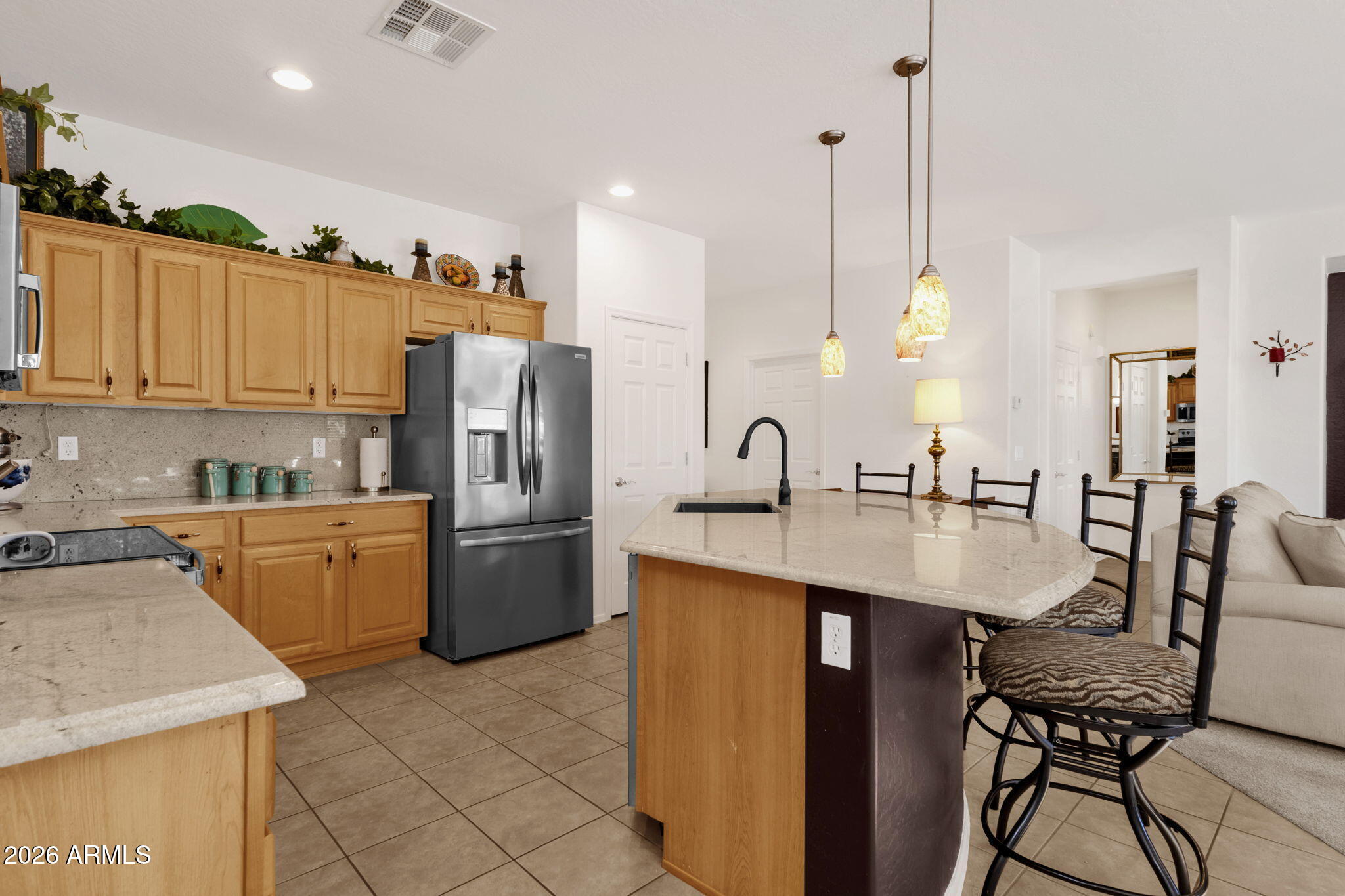 4094 East Azalea Drive Gilbert, AZ 85298 - Photo 9 of 21 a kitchen with a sink a counter top space appliances and cabinets