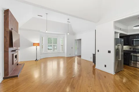 a view of livingroom with hardwood floor and a fireplace