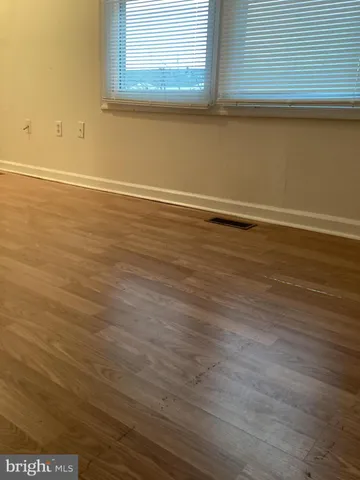 a view of a small space with wooden floor