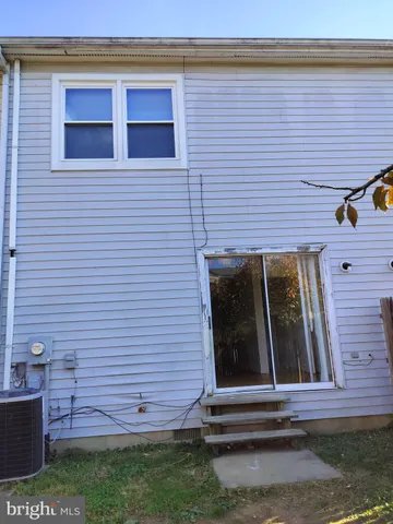 a view of brick house with a large window