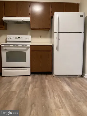 a view of a kitchen with washer and dryer