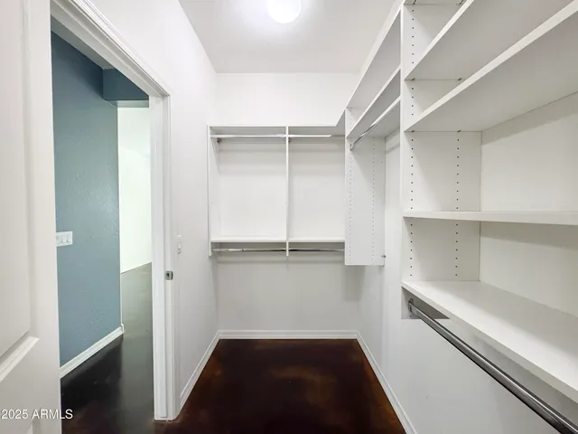 a bathroom with a double vanity sink a mirror and a bathtub