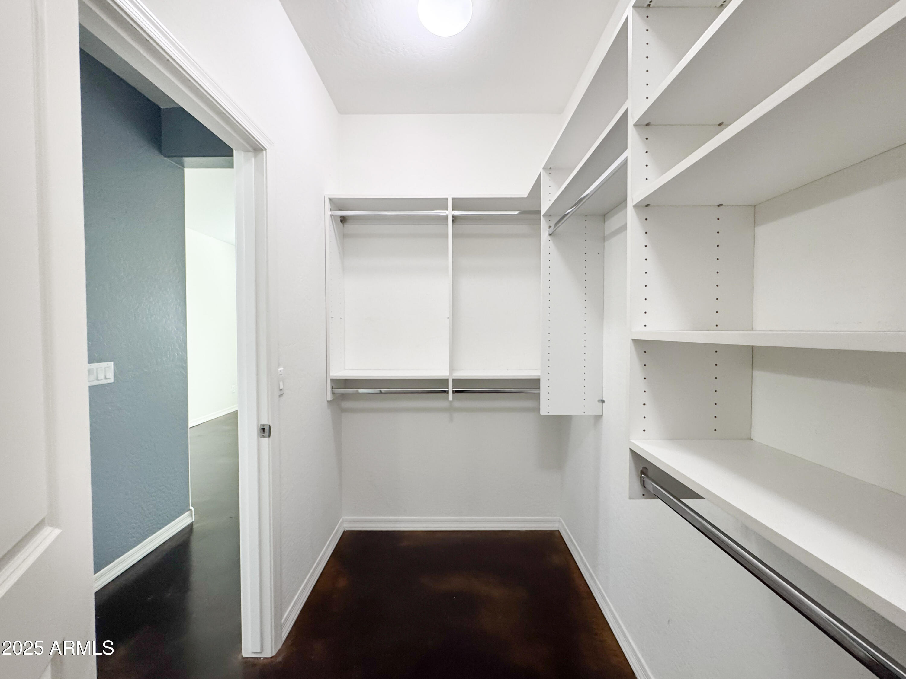 3141 East Patrick Street Gilbert, AZ 85295 - Photo 17 of 32 a view of walk in closet with empty racks