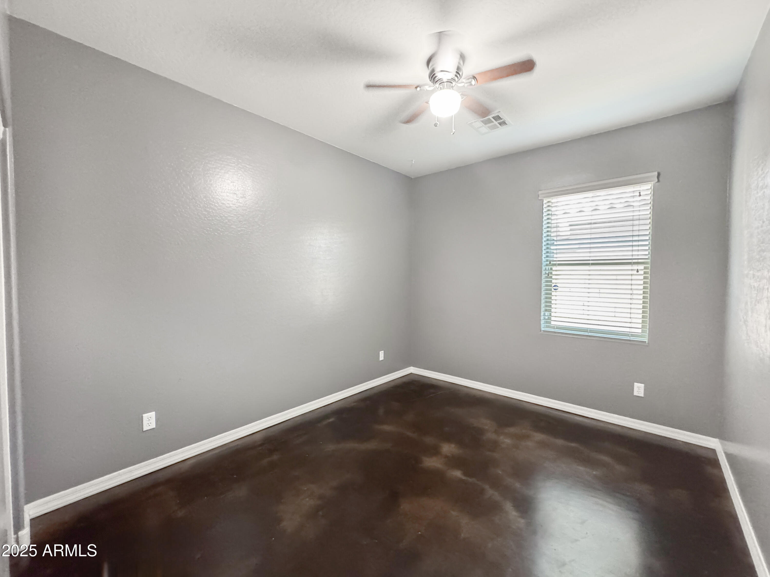 3141 East Patrick Street Gilbert, AZ 85295 - Photo 23 of 32 an empty room with a fan & a window